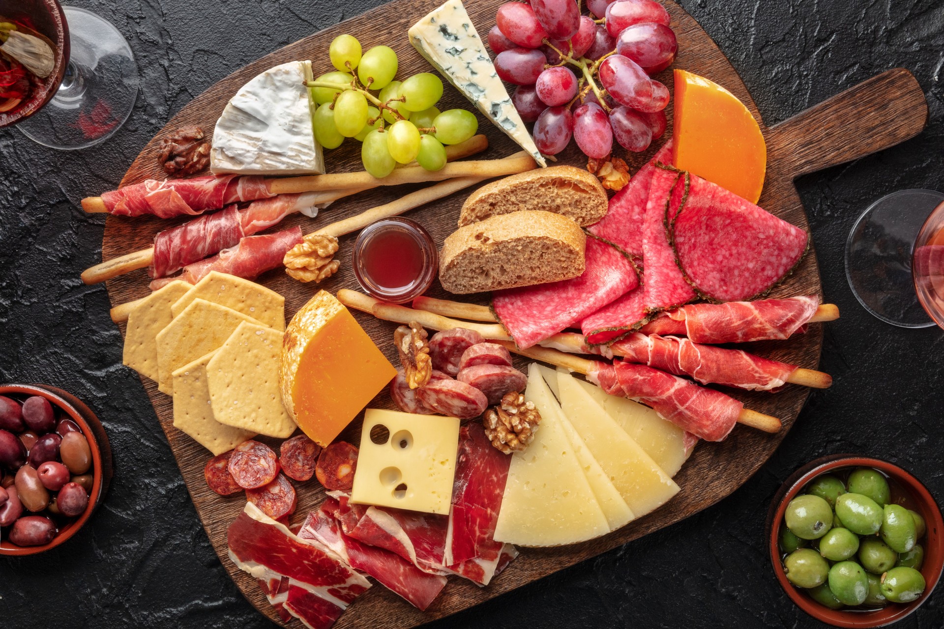 Antipasti or tapas. Charcuterie and cheese board with fruit, . Cold cuts