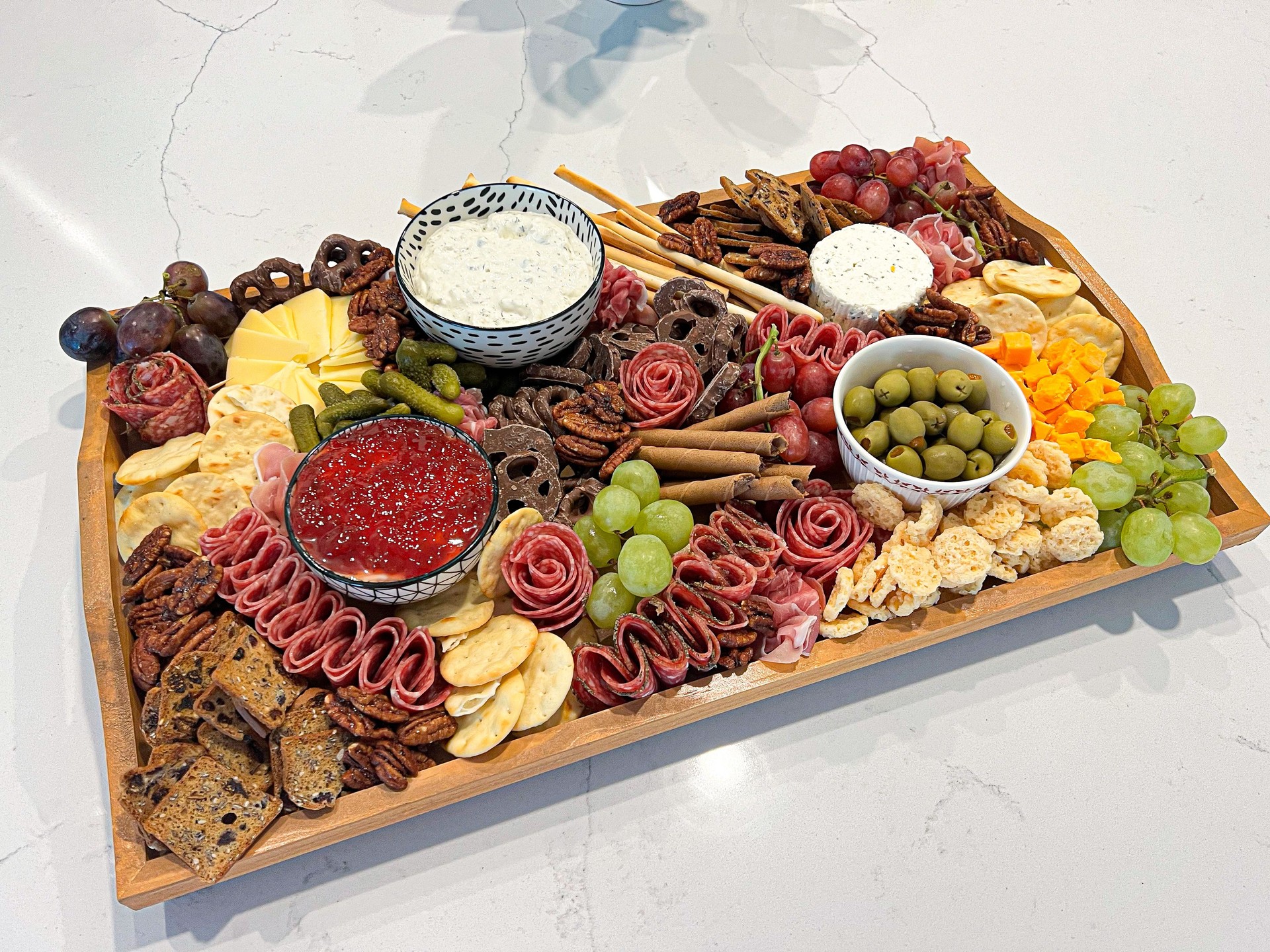 Elegant Charcuterie Board with Meats, Cheeses, and Fresh Garnishes